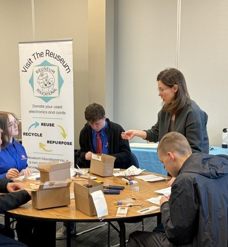 Amanda working with TechSkills America building Piano Kits.